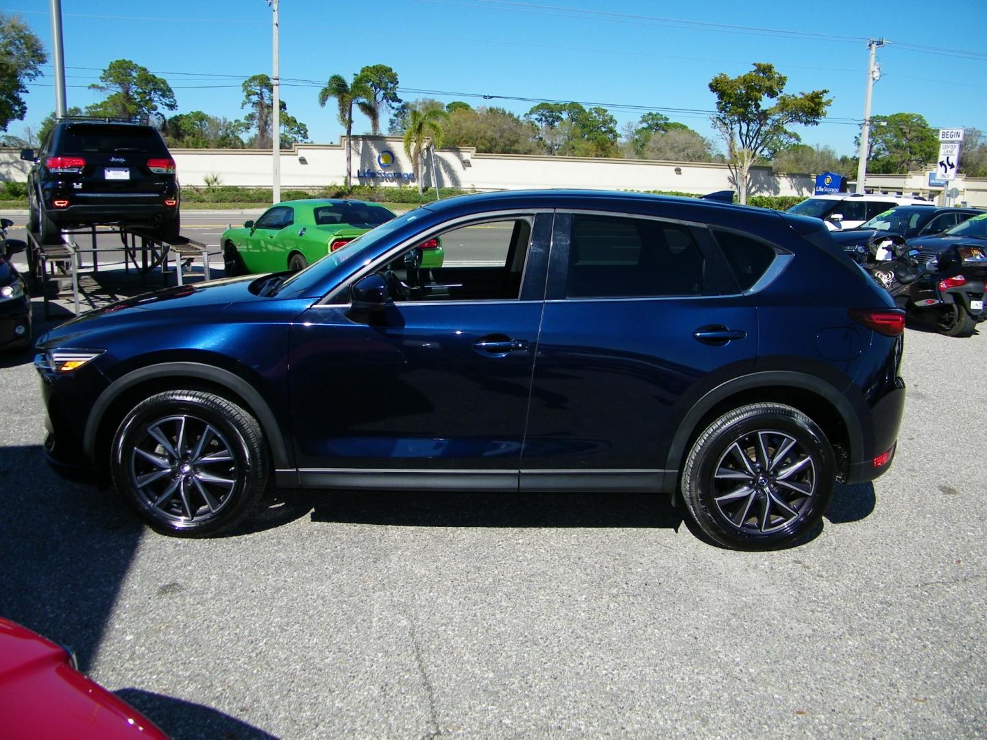 2018 Blue /Black Mazda CX-5 Grand Touring (JM3KFADM8J1) with an 2.5L L4 DOHC 16V engine, 6A transmission, located at 4000 Bee Ridge Road, Sarasota, FL, 34233, (941) 926-0300, 27.298664, -82.489151 - Photo#2